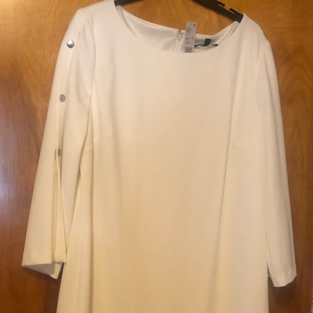 White dress with sliver studs on the arm